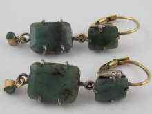 Appraisal: A pair of emerald earrings set in yellow and white