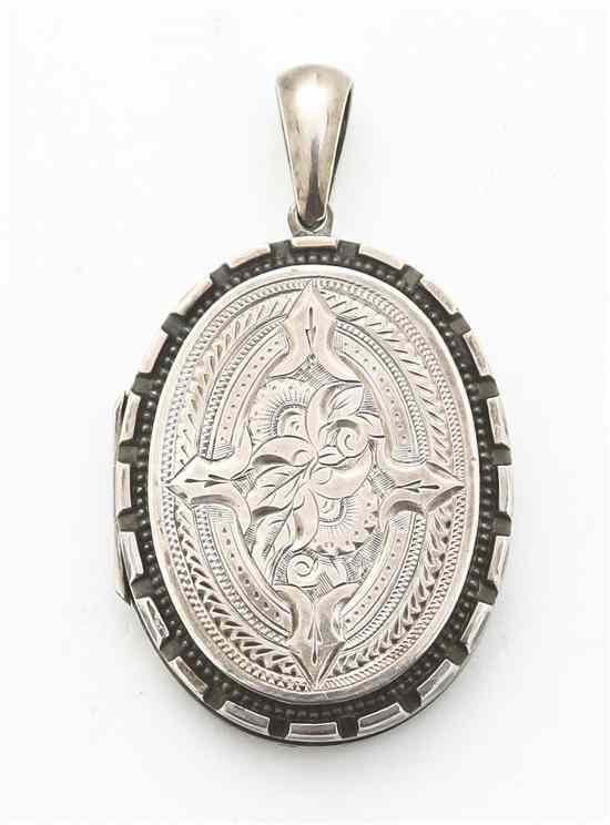 Appraisal: A Renaissance Revival Style Silver Locket with incised decoration opening