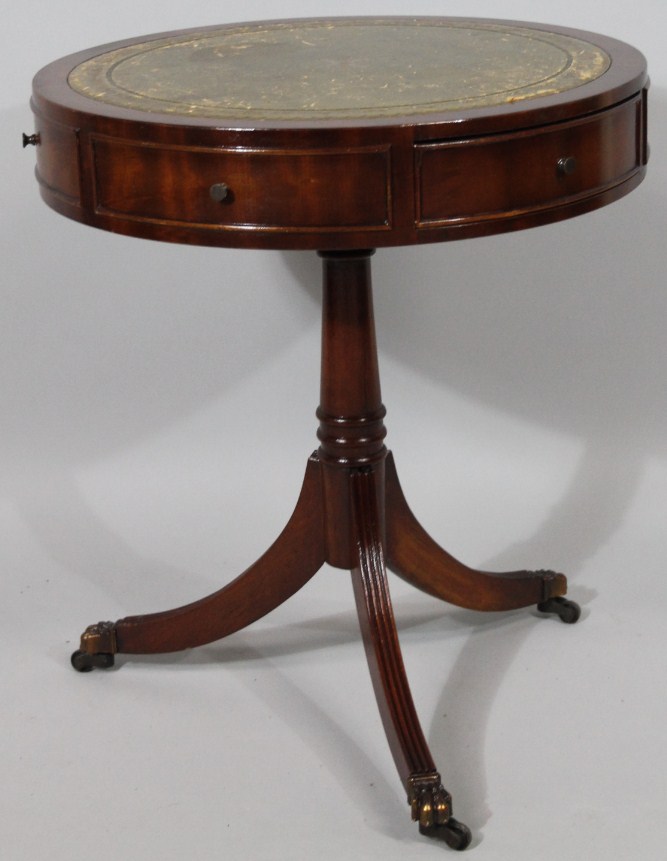 Appraisal: A thC mahogany finished drum table the circular top set