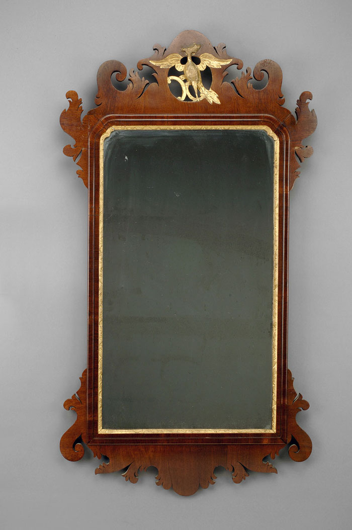 Appraisal: CHIPPENDALE CARVED MAHOGANY MIRROR WITH GILTWOOD PHOENIX The scrolled crest