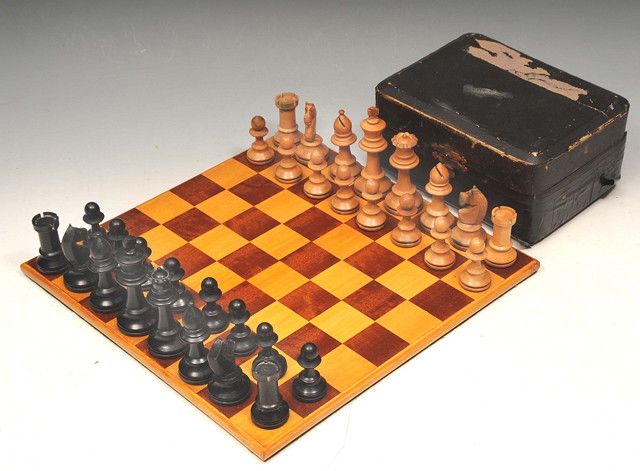 Appraisal: A STAUNTON TYPE CARVED BOXWOOD CHESS SET together with a