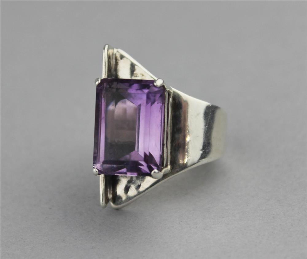 Appraisal: STERLING SILVER AND AMETHYST RING in a contemporary design with