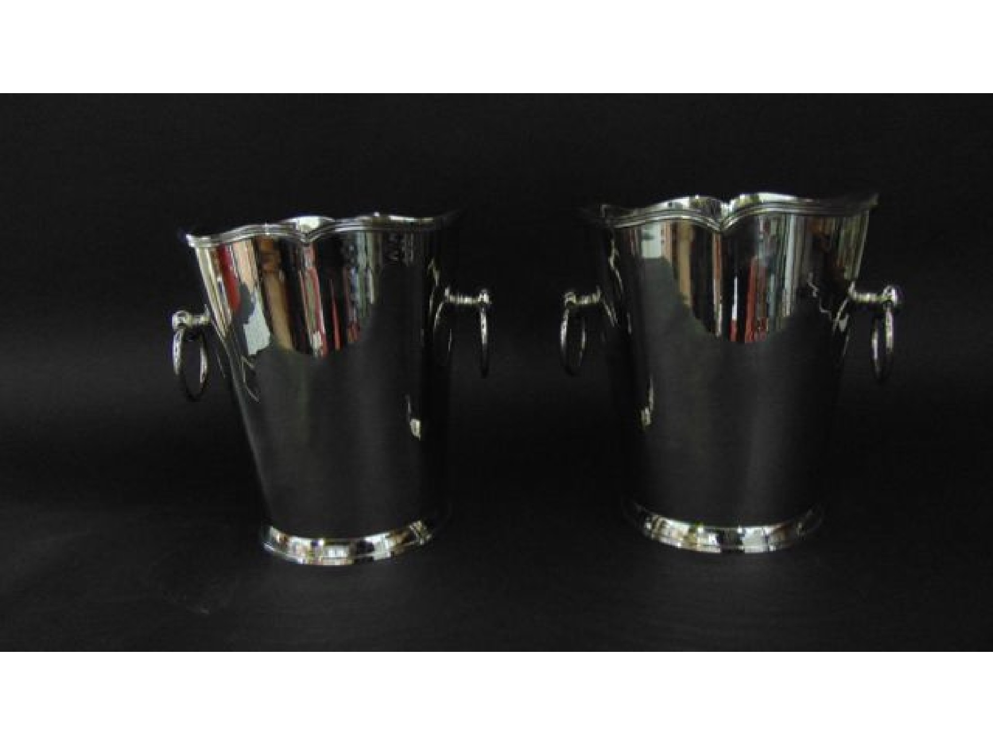 Appraisal: A pair of contemporary nickel plated wine coolers of tapering