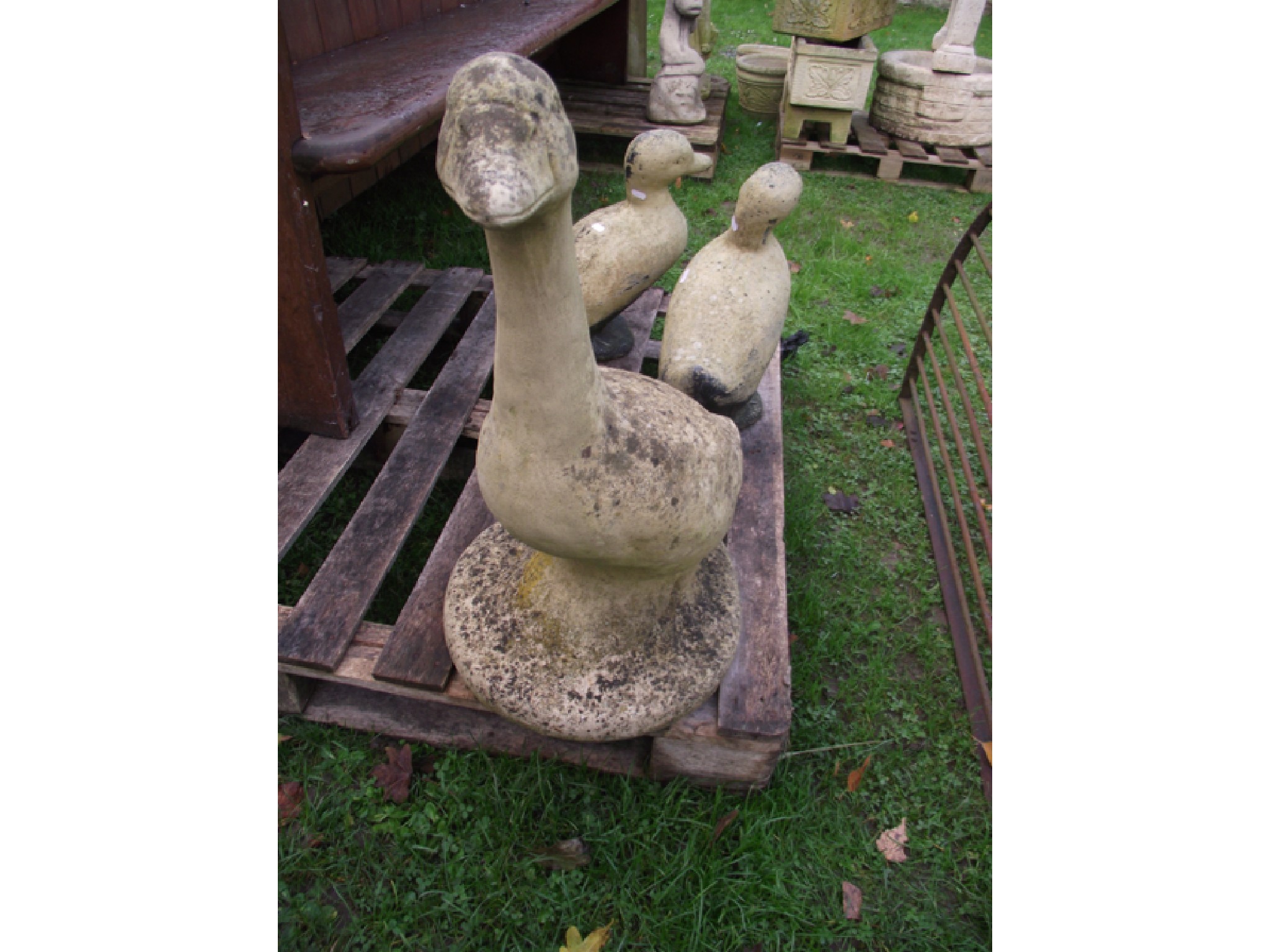 Appraisal: A weathered cast composition stone garden ornament in the form