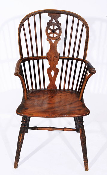 Appraisal: AN ANTIQUE ASH AND ELM WHEELBACK SPINDLE ARMCHAIR with turned