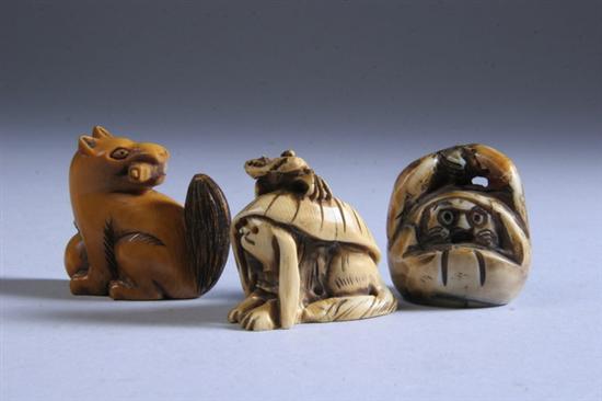 Appraisal: THREE JAPANESE IVORY NETSUKE th century Carved to depict crab