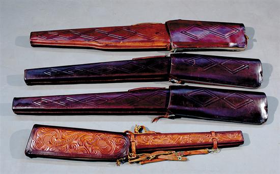 Appraisal: Four leather rifle cases decorated with embossed patterns L to