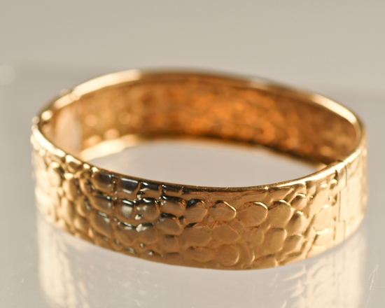 Appraisal: An Italian Gold Hinged Bangle Bracelet marked K and having