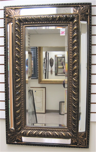 Appraisal: A RECTANGULAR WALL MIRROR double beveled the center mirror having