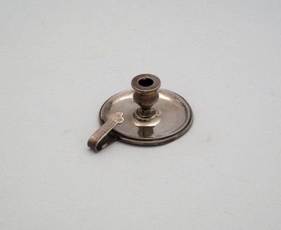 Appraisal: A silver miniature chamber stick by Grey and Co Chester