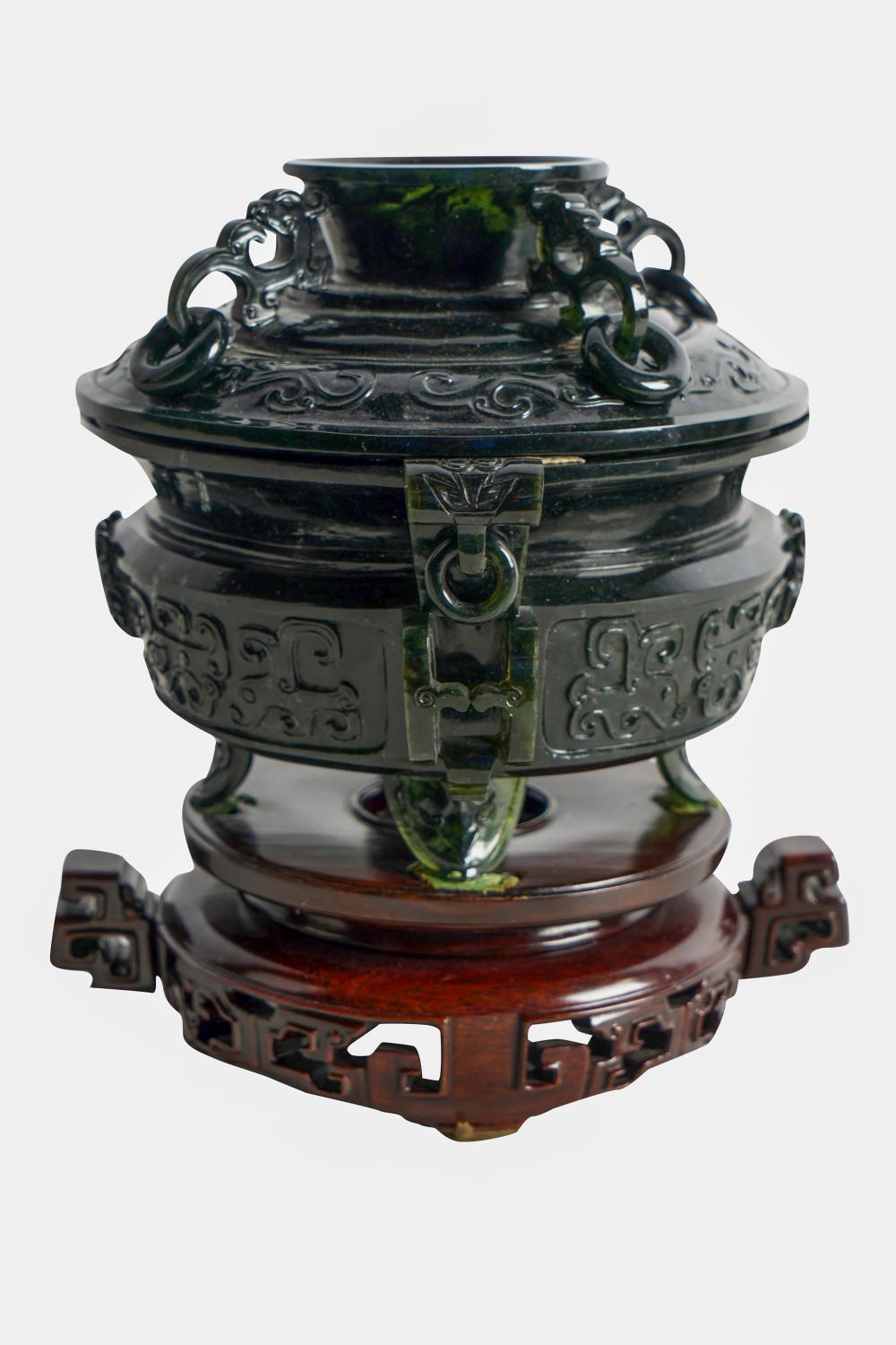 Appraisal: CHINESE CARVED GREEN JADE CENSERcircular with cover the body flanked