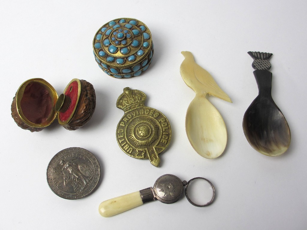 Appraisal: A nut shaped necessaire enclosing a thimble a Nepalese gilt