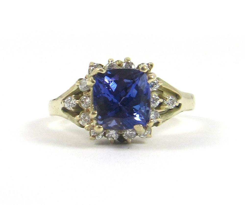 Appraisal: TANZANITE DIAMOND AND FOURTEEN KARAT GOLD RING with round-cut diamonds