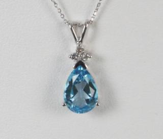 Appraisal: K DIAMOND AND BLUE TOPAZ PENDANT NECKLACE HAVING CTW DIAMONDS