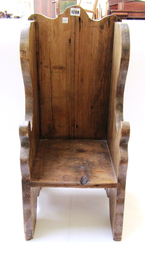 Appraisal: A child's pine throne chair of shaped plank construction cm