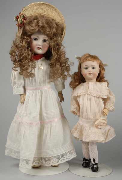 Appraisal: Lot of Pretty German Bisque Child Dolls Description Bisque socket