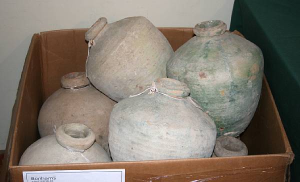 Appraisal: An assembled group of pottery vessels and storage jars