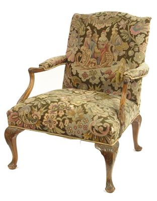 Appraisal: A library armchair upholstered in floral needlework the back depicting