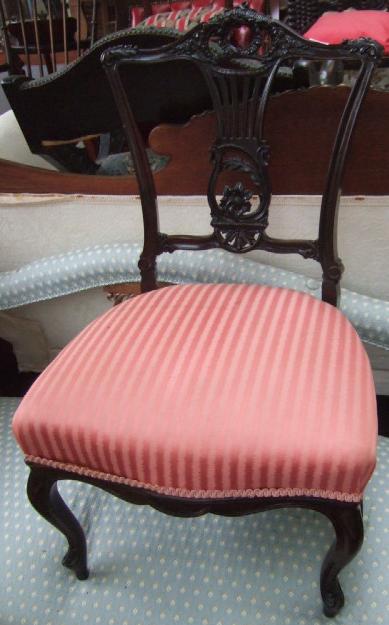 Appraisal: A Victorian carved mahogany nursing chair with pierced back over