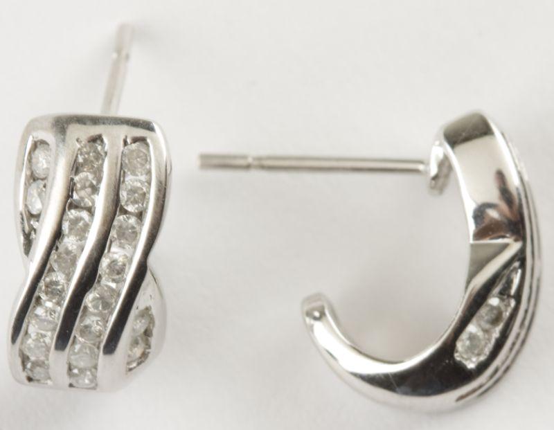 Appraisal: KT White Gold Diamond Earrings set in a crossover design