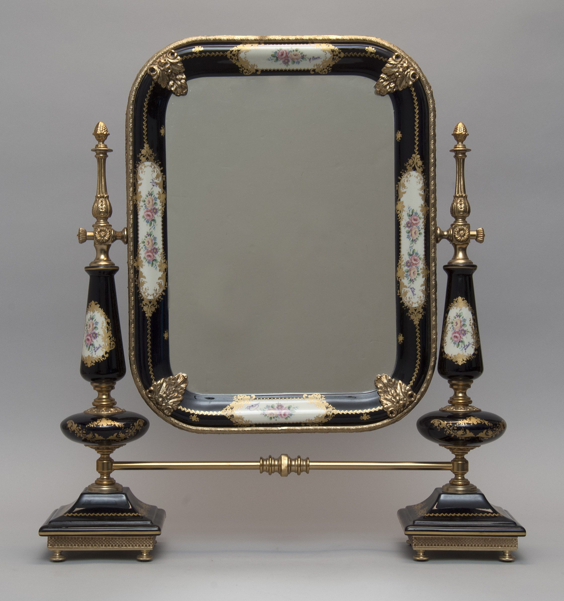 Appraisal: CONTINENTAL-STYLE ENAMEL-DECORATED AND ORMOLU-MOUNTED DRESSER MIRROR Mid-to-Late th CenturyIn th