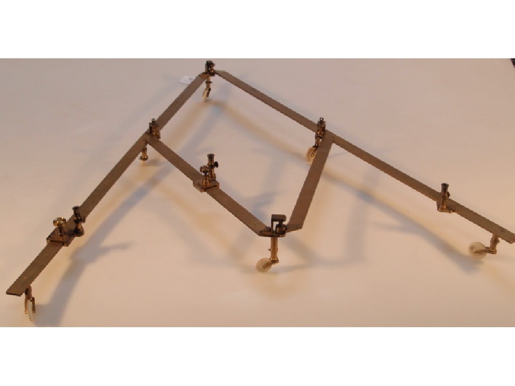 Appraisal: A Victorian gilt brass pantograph with turned ivory wheels and