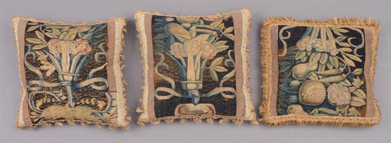 Appraisal: GROUP OF THREE SIMILIAR FLEMISH TAPESTRY-MOUNTED PILLOWS Each black ground