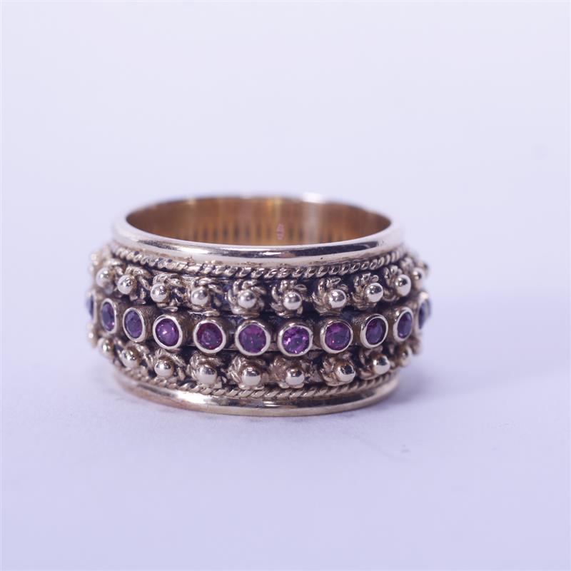 Appraisal: Gold K estate ring eternity band with red synthetic stones