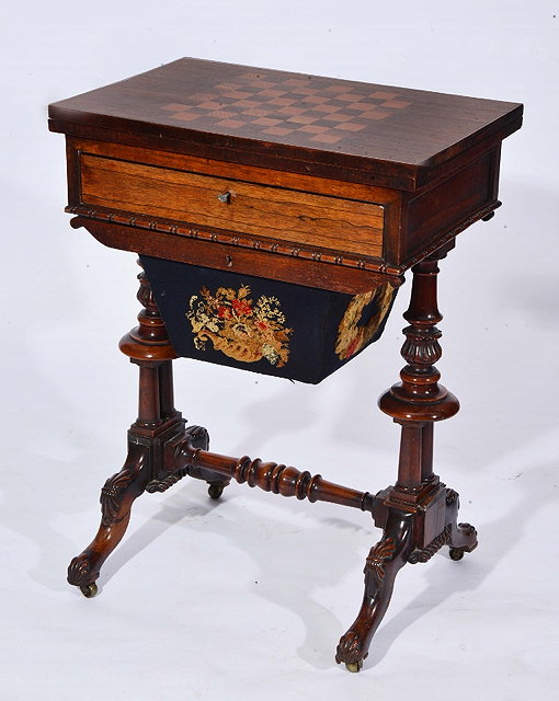 Appraisal: A VICTORIAN ROSEWOOD COMPENDIUM TABLE with fold over chess board