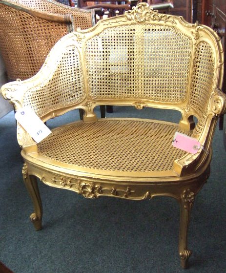 Appraisal: A gilt framed Bergere circa with carved crest and outswept