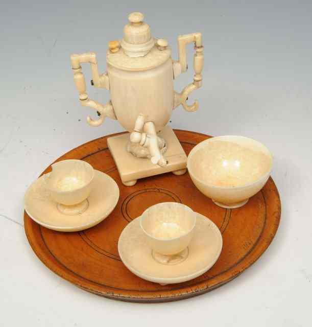 Appraisal: A TH CENTURY MARINE IVORY TOY TEASET consisting of a