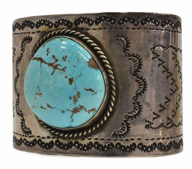 Appraisal: Native American silver content unknown cuff bracelet central bezel-set turquoise