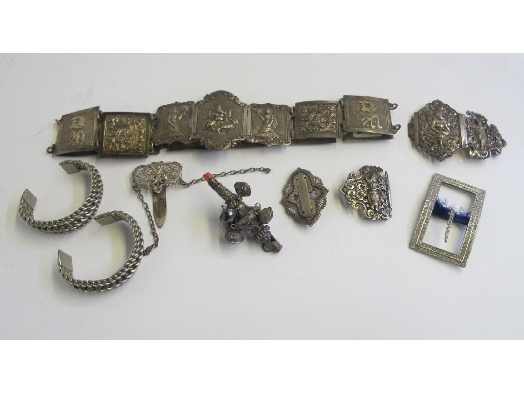 Appraisal: Lot comprising Eastern white metal belt baby rattle buckles etc