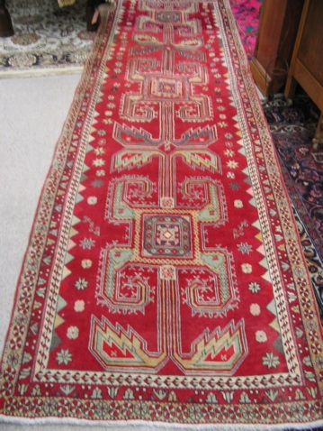 Appraisal: PERSIAN TRIBAL RUNNER repeating geometric medallion and -point star decoration