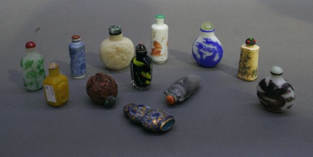 Appraisal: Twelve Chinese snuff bottles including carved and overlaid glass hardstone