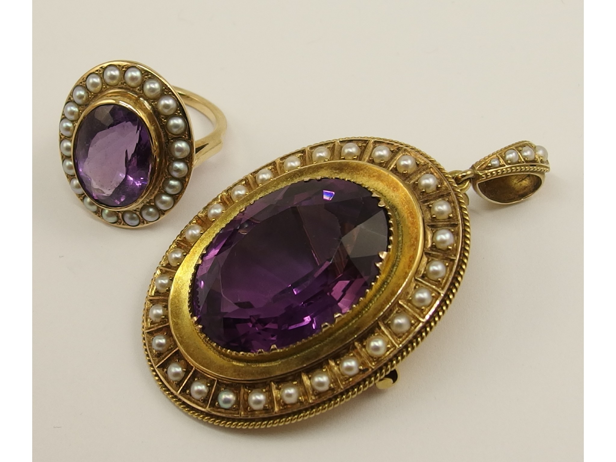 Appraisal: A Victorian pendant broochset with a large oval amethyst in