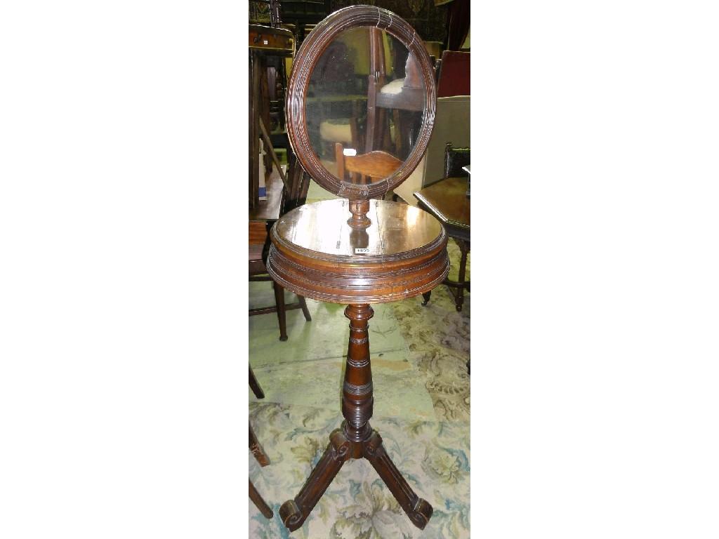 Appraisal: An Edwardian walnut floor standing shaving stand the circular adjustable