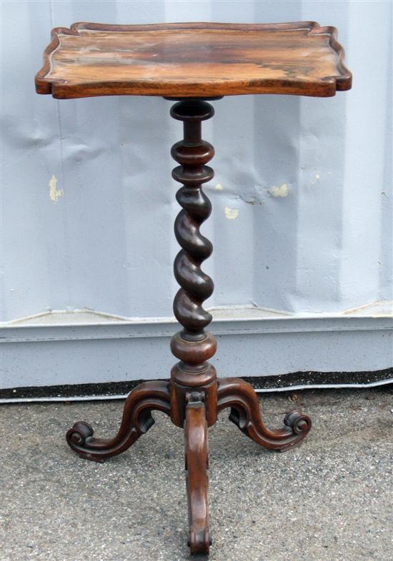 Appraisal: A th century rosewood rectangular serpentine table on sprial twist