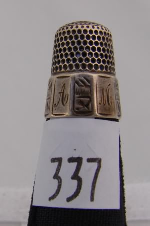 Appraisal: Simons thimble with engraved panel band