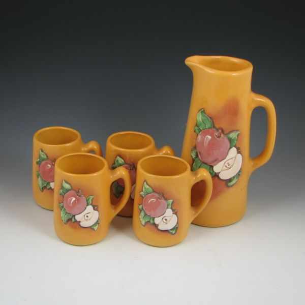 Appraisal: Wihoa's Four Mug and Tankard Set yellow with apple design