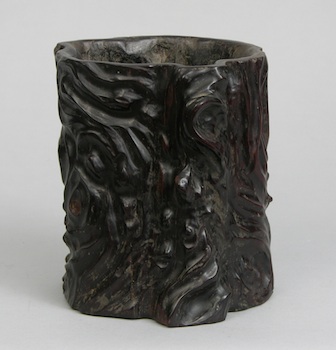 Appraisal: A Carved Zitan Brushpot Chinese Carved with irregular sides in