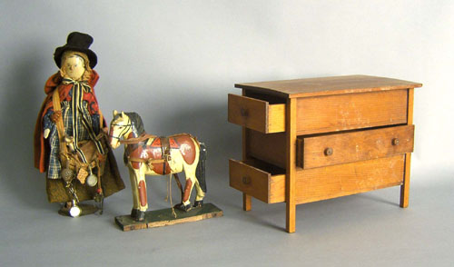 Appraisal: Painted wood doll together with a horse toy and a