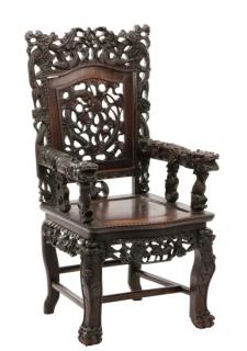 Appraisal: Chinese Carved Hardwood Dragon Armchair An early th century Chinese