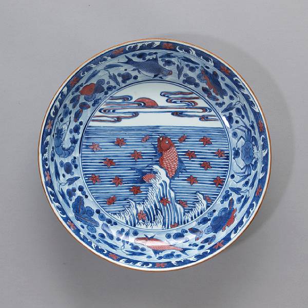 Appraisal: An underglaze blue and copper red-decorated porcelain dish with leaping