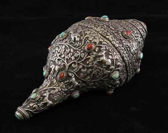 Appraisal: A Tibetan silver mounted conch shell th century mounted with