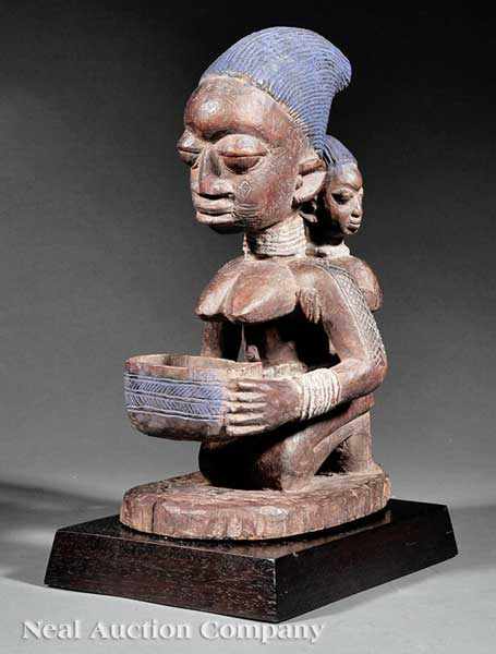 Appraisal: An African Carved Wood Figural Group of a Mother and