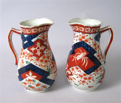 Appraisal: Pair of pitchers Decorated with floral and bird decorations in