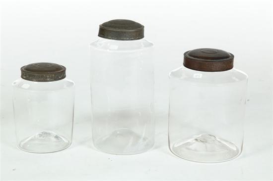 Appraisal: THREE BLOWN GLASS CANISTERS American th century With tin lids