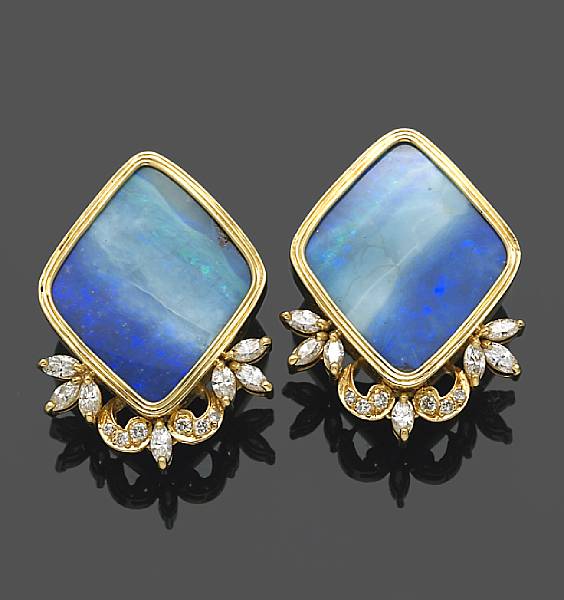 Appraisal: A pair of opal and diamond earclips mounted in fourteen