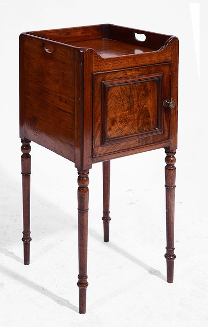 Appraisal: A GEORGE IV MAHOGANY TRAY TOP NIGHT CUPBOARD with panelled